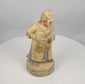 Rotating presentation of an antique Chinese polychrome wooden attendant holding a ceremonial vessel, with a tall headdress and surviving Qing Dynasty pigment.