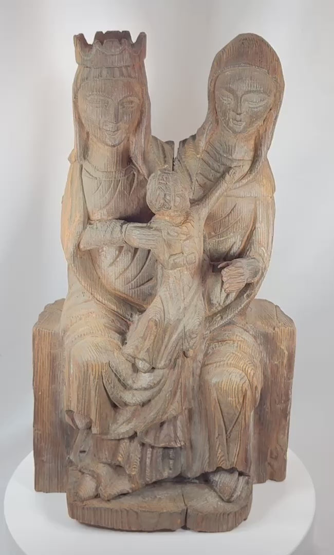360-degree view of an antique European Gothic Revival carved wooden sculpture depicting the Virgin Mary, Saint Anne, and the Christ Child with visible age wear, natural wood grain, and devotional ecclesiastical styling