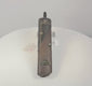 Antique Japanese Meiji period kayaku-ire gunpowder flask rotating to show the floral mixed-metal decoration, textured body, powder spout, securing chain and reverse suspension clip