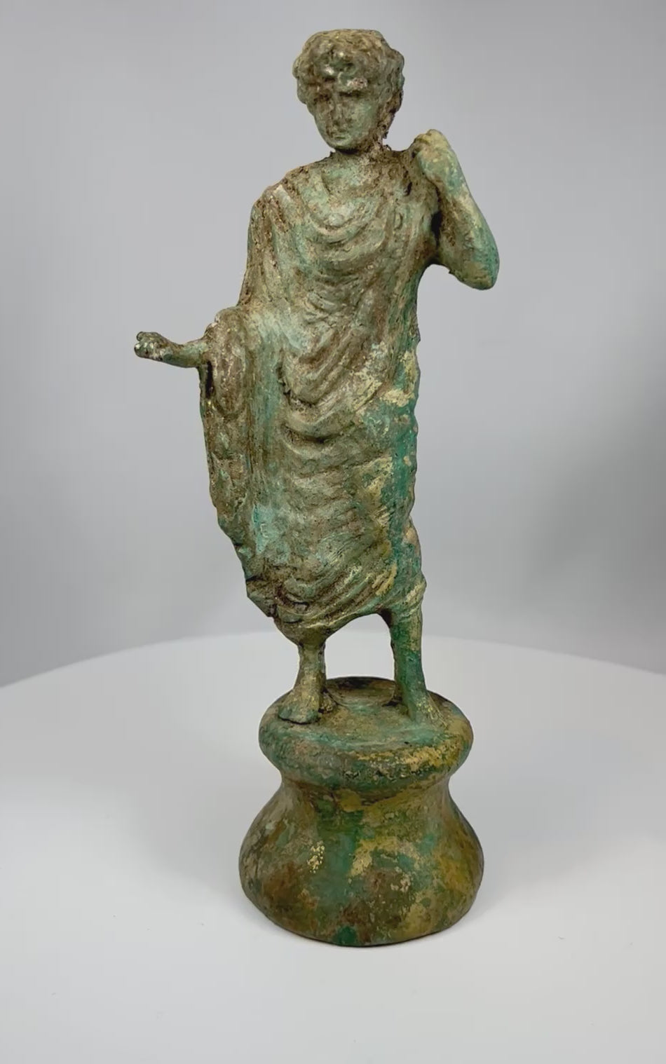 Video showcasing antique neoclassical bronze draped figure with pedestal base and aged verdigris patina from multiple angles