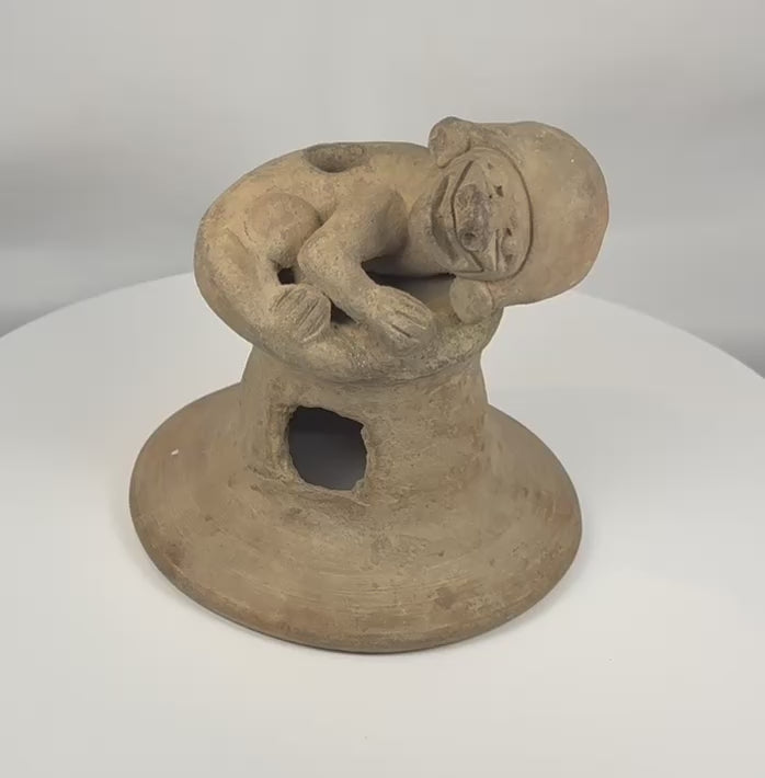 Pre-Columbian Manteño terracotta incensario from coastal Ecuador shown in a rotating 360-degree view, featuring a recumbent anthropomorphic figure, ceremonial vent openings, archaeological patina, and hand-modeled construction. The video concludes with original McMillan Collection provenance documentation and period collection photographs.