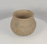 Rotating view of an authentic Pre-Columbian Casas Grandes corrugated pottery jar from northern Mexico, highlighting its hand-built earthenware construction, textured surface, corrugated shoulder bands, archaeological patina, and ancient utilitarian form.