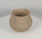 Rotating view of an authentic Pre-Columbian Casas Grandes corrugated pottery jar from northern Mexico, highlighting its hand-built earthenware construction, textured surface, corrugated shoulder bands, archaeological patina, and ancient utilitarian form.