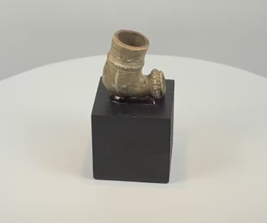 Video showcasing an antique African pottery tobacco pipe bowl with a cylindrical smoking chamber, decorative bands, projecting stem socket and aged surface patina, circa 1880–1930