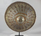 Rotating view of a late 19th-century Ethiopian Ras shield with a convex hide body, golden-brown velvet covering, pierced and engraved silvered and gilt metal mounts, radiating bosses, a large central sunburst boss, red leather reverse, and original padded handgrip