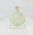 360-degree view of an ancient Roman free-blown pale green glass flask with flattened circular body, elongated neck, burial encrustation, iridescence, and historic repairs displayed on a clear acrylic stand.