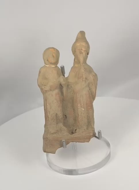 360-degree video of an ancient Greek terracotta votive figural group from Taormina, Sicily, showcasing two stylized standing figures, archaeological patina, and hand-modeled Classical craftsmanship.