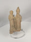 360-degree video of an ancient Greek terracotta votive figural group from Taormina, Sicily, showcasing two stylized standing figures, archaeological patina, and hand-modeled Classical craftsmanship.