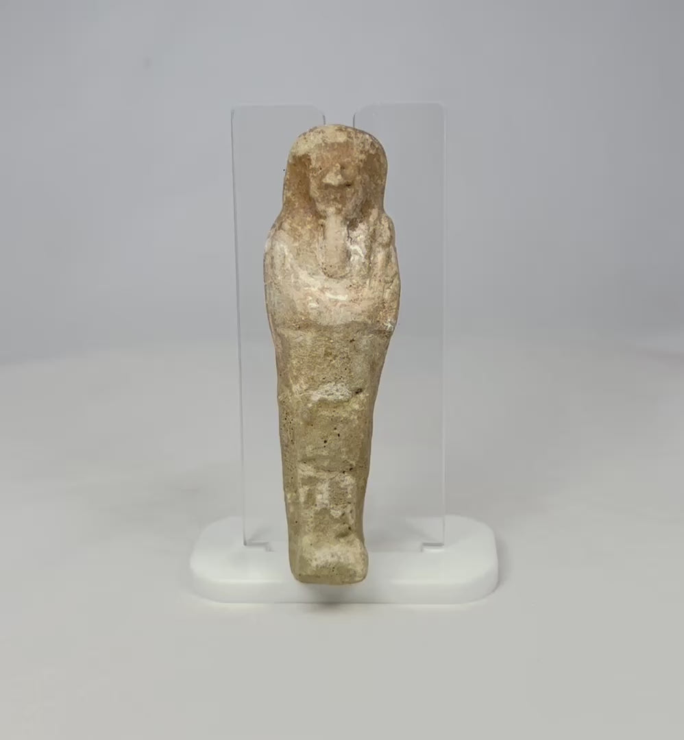 360 rotating video view of an Egyptian ushabti statue on a clear acrylic support.