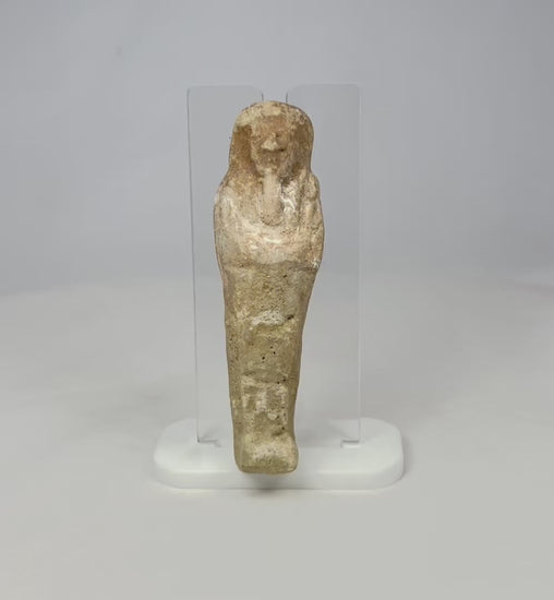 360 rotating video view of an Egyptian ushabti statue on a clear acrylic support.