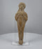 Ancient Roman terracotta fertility votive figure dating to the 1st–3rd century CE, featuring raised arms with sculpted fingers, stylized facial features, traditional hairstyle, intricate incised torso decorations, hand-formed clay construction, natural mineral deposits, and aged earthen patina.