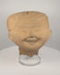Pre-Columbian Veracruz Sonriente terracotta head with smiling expression, scroll-motif headdress and hollow ceramic construction