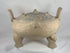 360-degree video of a large ancient Chinese terracotta zoomorphic ritual vessel from the Eastern Zhou to Han Dynasty, showcasing its pierced domed lid, tripod feet, upright handles, incised decoration, archaeological patina, and sculptural ceremonial form.