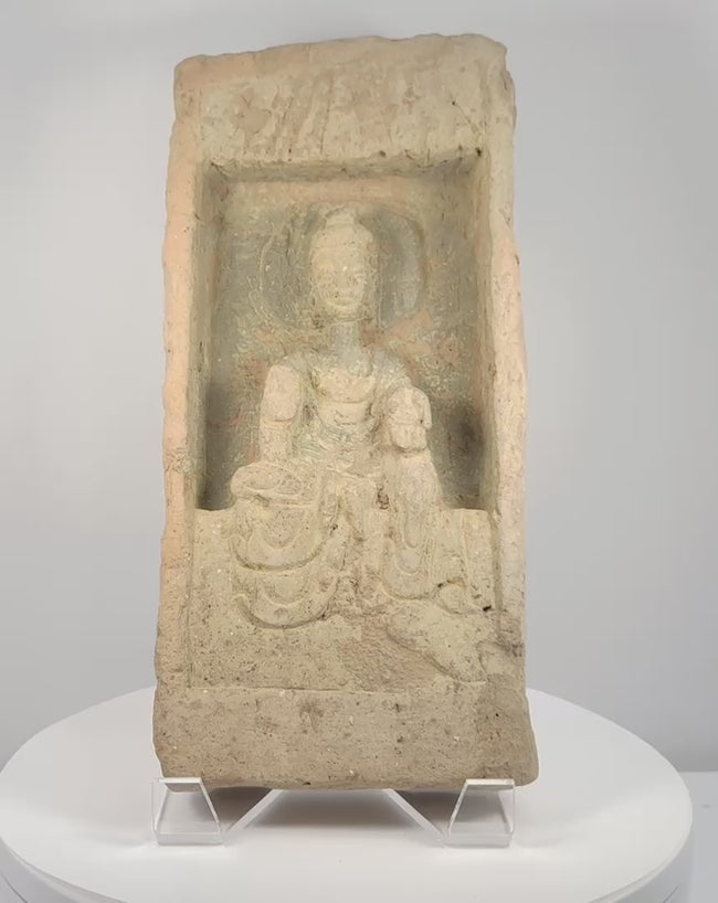 Rotating presentation of Northern Wei Dynasty Buddhist terracotta architectural brick with seated Buddha relief, circa 386–534 CE