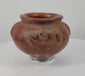 360-degree rotating view of a Pre-Columbian terracotta vessel dating to circa 1000–1500 CE, featuring sculpted ornamental handles, intricate decorative motifs, earthy red clay, and a naturally weathered surface.