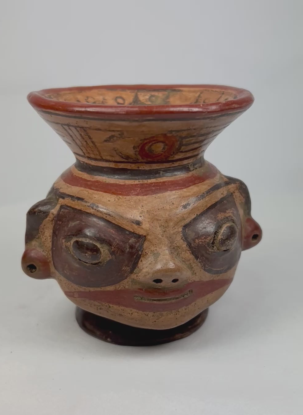 360-degree rotation of Nicoya effigy vessel with human head and painted geometric motifs, 800–1200 AD