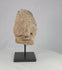 Bura Culture terracotta head fragment on black display stand, shown rotating to reveal multiple angles and surface details.