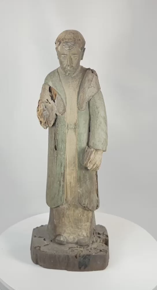 360-degree rotating view of Spanish Colonial hand-carved santo figure showing aged patina, carving details, and surface wear