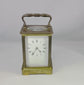 360° view of an antique French carriage clock by Jules Bunelot with brass frame, beveled glass panels, and enamel dial.