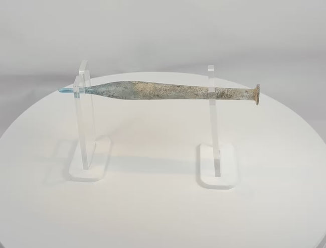 360-degree view of an ancient Roman blue glass candlestick unguentarium, circa 1st–3rd Century AD, showcasing its elongated fusiform body, narrow tubular neck, flared rim, archaeological weathering, iridescence, and exceptional Roman glassmaking craftsmanship.