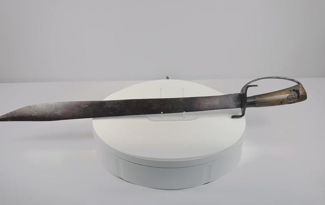 Video showing multiple views and construction details of an attributed 18th-century Colonial American blacksmith-made hanger sword