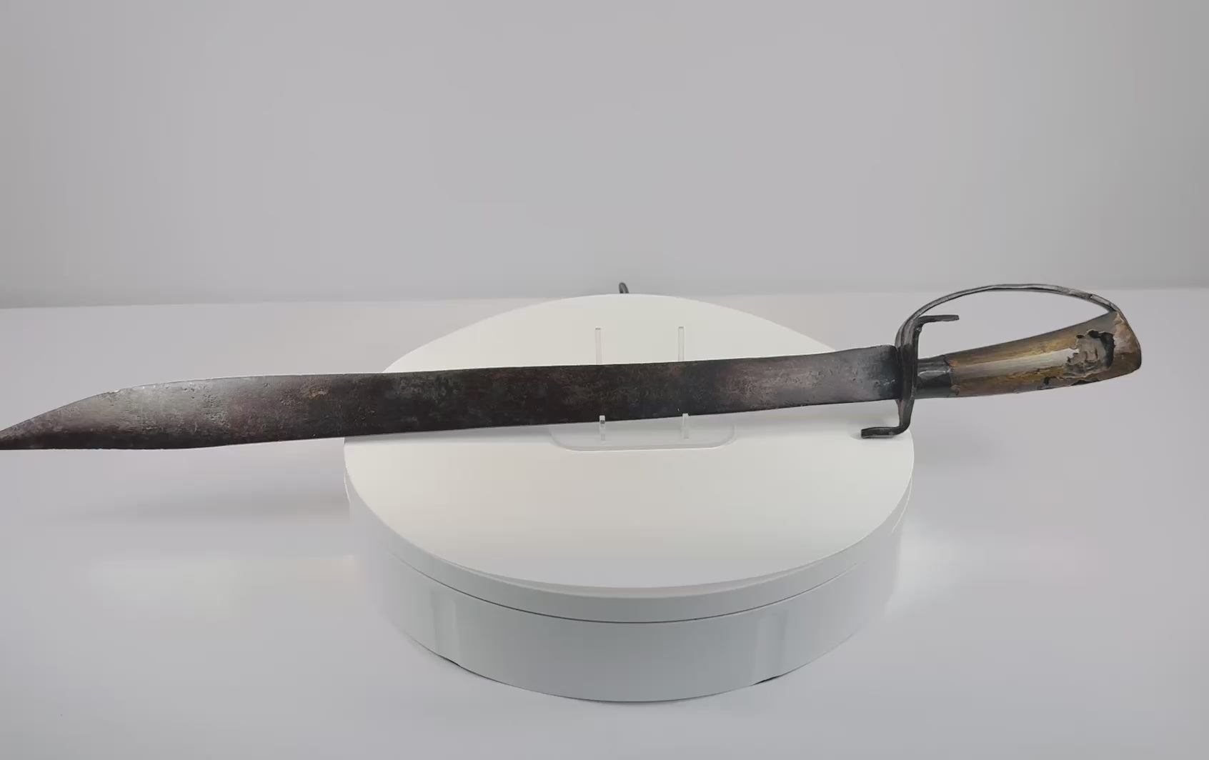 Video showing multiple views and construction details of an attributed 18th-century Colonial American blacksmith-made hanger sword