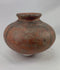 360-degree view of an authentic West African terracotta vessel showing its rounded form, black painted geometric decoration, warm earthen surface tone, and natural aging patina.