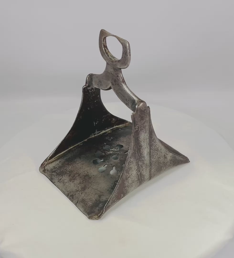 360-degree video showcasing an authentic 17th-century Ottoman cavalry stirrup in forged steel with faint silver inlay, displayed upright on a white studio background.