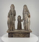 Antique Spanish Colonial Holy Family wooden santo from the Philippines, dating to the 18th–19th century, featuring hand-carved figures of Jesus, Mary, and Joseph, softened facial details, remnants of original painted decoration, natural wood patina, age-related surface wear, and an integral carved wooden platform.