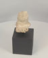 360-degree view of a Pre-Columbian terracotta female figure fragment featuring a large ceremonial headdress, stylized facial features, and symbolic fertility attributes, Mesoamerica, circa 300 BCE–600 CE.