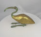 360-degree video of an Egyptian Revival sacred ibis sculpture featuring a gilt body, verdigris-patinated neck and legs, red inset eye, and elegant mixed-media construction, showcasing the sculpture from all angles.