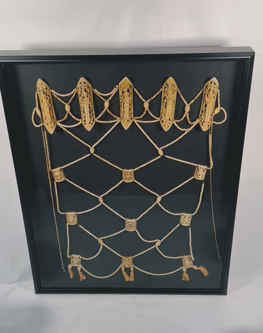 Rare 19th-century Himalayan Tibetan Tantric ritual apron (rus gyan) made of human and animal bones, featuring six elliptical plaques depicting Chakrasamvara deities, crisscrossed bone bead lattice, cotton backing, and natural pigments, ceremonial and devotional garment