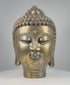360-degree rotating view of a vintage cast bronze Buddha head, circa 1950–1990, featuring a golden patinated finish, intricate spiral curls, raised ushnisha, elongated earlobes, serene facial expression, and decorative banded neck. The video highlights detailed craftsmanship, surface oxidation, and signs of age from multiple angles.