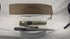 Rotating view of a late 19th-century Tibetan embroidered belt and dagger ensemble with a single-edged steel blade, faceted horn handle, silvered guard, leather-covered wooden scabbard, embossed metal mounts, suspension cord, and richly decorated textile belt