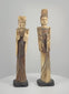 Rotating video of a matched pair of vintage Chinese carved-bone Emperor and Empress figurines, mid-to-late 20th century, featuring elaborate headdresses, expressive facial details, flowing imperial-style robes, decorative accessories, contrasting cream and dark-brown surfaces, and individual black display bases.