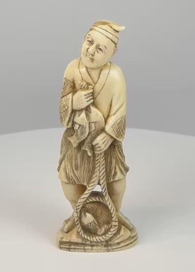 360-degree video of an antique Japanese Meiji–Taishō fisherman okimono carrying fish and a woven catch basket