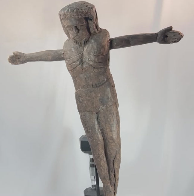 Rotating view of Spanish Colonial carved wooden corpus of Christ with aged patina and expressive detailing