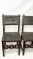 Close-up video zooming in on a pair of 17th-century Spanish Baroque walnut chairs with studded leather upholstery.