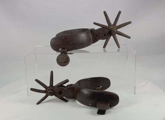360-degree video of antique Mexican Charro cowboy spurs showing hand-forged iron construction, large star rowels, rich age patina, and authentic working wear