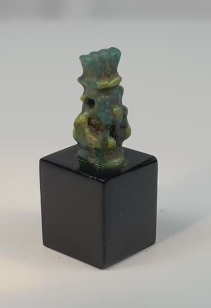 360-degree view of an ancient Egyptian blue-green faience amulet depicting the protective dwarf deity Bes from the Late Period to Ptolemaic era.