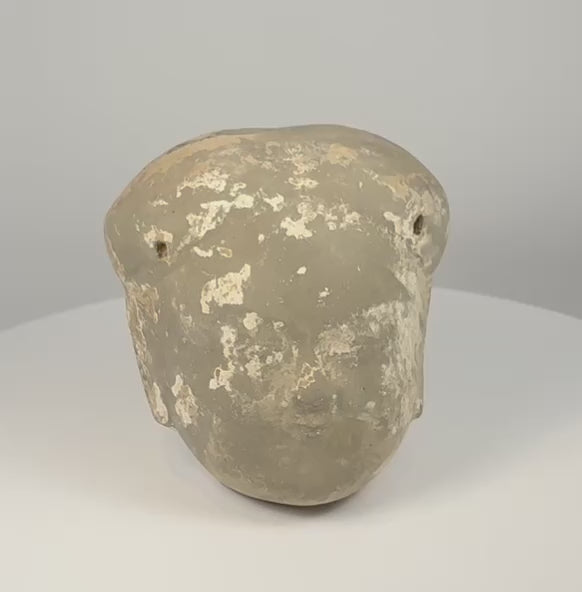 Ming Dynasty Chinese terracotta head fragment showing softly modelled features, aged surface deposits and hollow sculptural construction