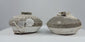 Video showcasing a pair of Sawankhalok shipwreck jarlets, circa the 15th–16th century, with squat stoneware bodies, flared rims, partial brown glaze, and marine encrustations.