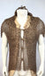Zoomed in video of antique Moro mail armour showing the bronze rings, peaked shoulders, hide undercoat, collar, and front ties