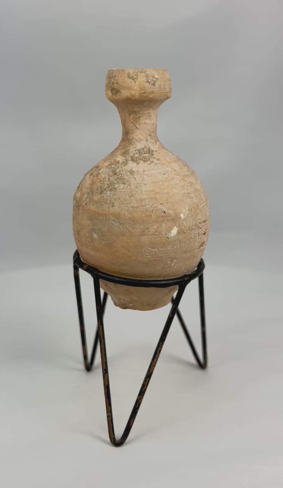 Ancient Roman terracotta oil vessel 360-degree view showing complete form, rounded body, short neck, and authentic burial patina from the 1st–3rd century AD.