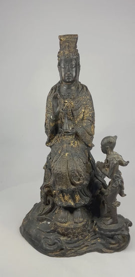 360-degree video of a late 19th–early 20th century Thai bronze Guanyin statue with child attendant, showing full lotus pedestal and remaining gilt highlights.