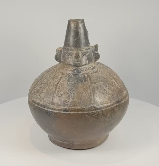 Rotating 360-degree video of a Sicán Lambayeque blackware vessel, circa 750–1375 AD, showing its complete form, burnished ceramic surface, base, opening, and aged details.