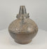 Rotating 360-degree video of a Sicán Lambayeque blackware vessel, circa 750–1375 AD, showing its complete form, burnished ceramic surface, base, opening, and aged details.