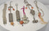 Video presenting six antique Chinese chatelaine, amulet and garment ornaments with silver-alloy metalwork, beads, bells and textile tassels