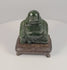 Vintage Chinese dark green hardstone Budai Laughing Buddha sculpture rotating on fitted hardwood display stand