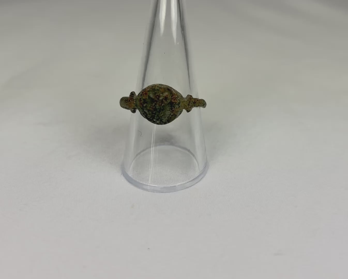 Ancient Roman cast bronze seal ring, 1st–3rd Century CE, featuring an engraved hippocampus on the bezel. Symbolic of Neptune and Roman maritime power, used as a personal seal and adornment. Developed patina reflects age and authenticity, with the bezel design well-preserved despite a broken band.